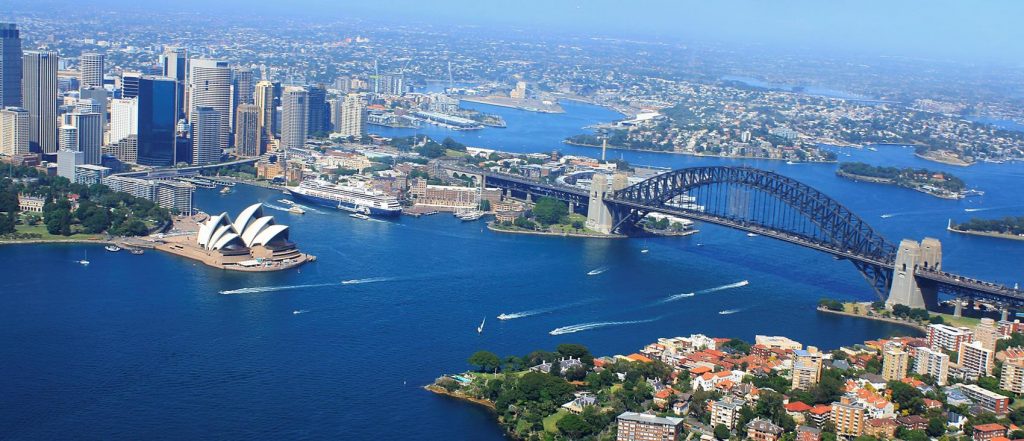 Sydney harbour with the bridge on the right and the opera house on the left